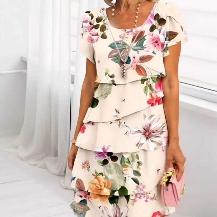LYRA I MEHRLAGIGES GEBLÜMTES KLEID